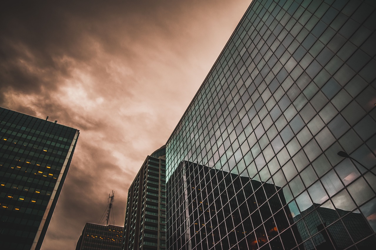 Glass office building facade at dusk